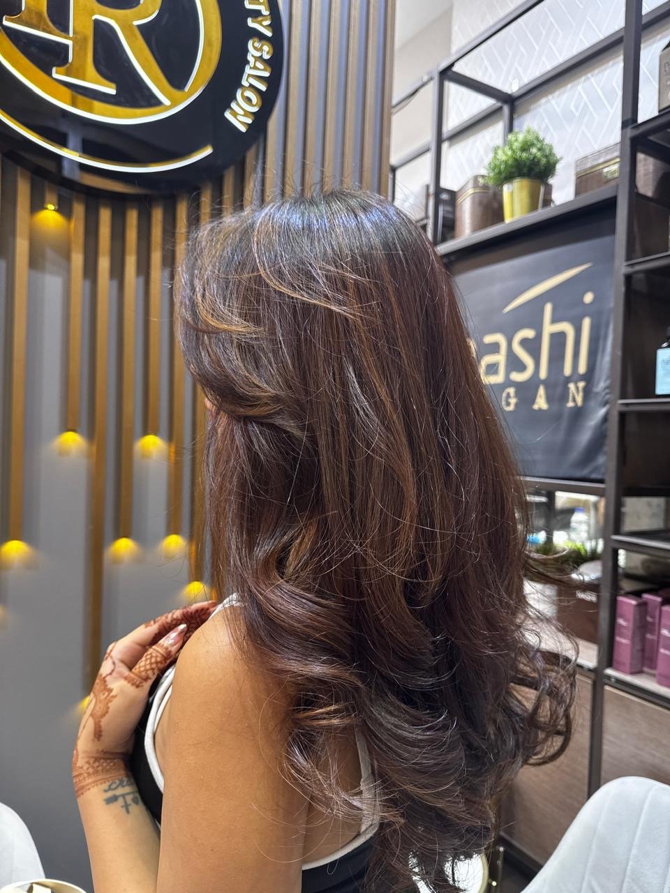 Long layered haircut at Front Row Beauty Salon