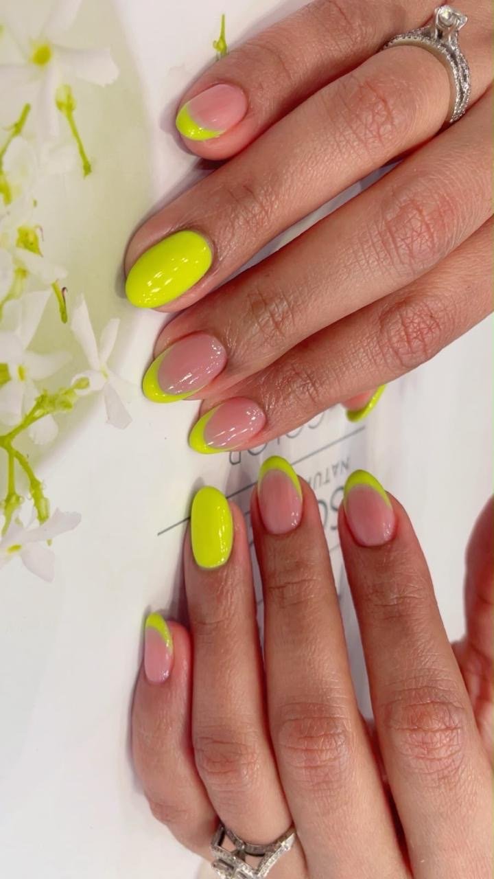 Neon French tip nail art at Front Row Beauty Salon