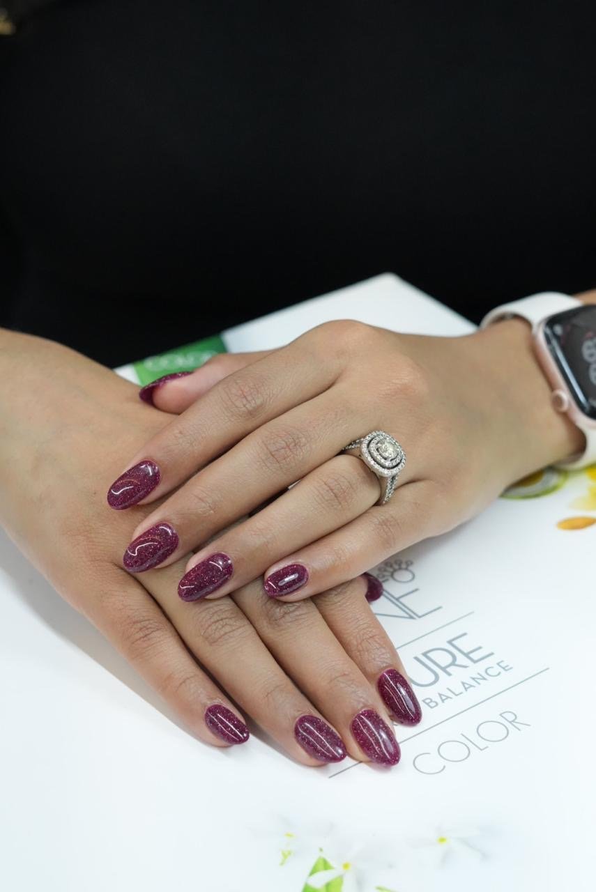 Shimmer burgundy nail art at Front Row Beauty Salon